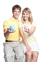 Image showing Young couple saving money