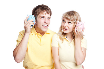 Image showing Young couple saving money