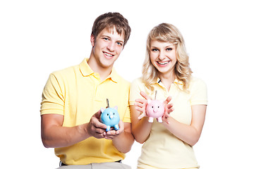 Image showing Young couple saving money