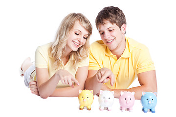 Image showing Young couple saving money