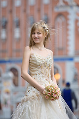 Image showing Bride with cream-colour rose bouquet