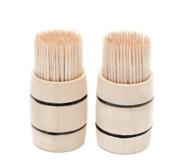 Image showing Two birch of the toothpick in wooden cask