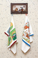 Image showing Dishtowels hung on wooden hatrack