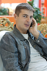 Image showing Man smiles with telephone in hand