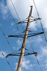 Image showing Pole high-tension wire on background blue sky