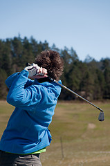 Image showing Male golfer in his finish