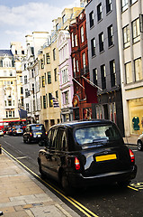 Image showing London taxi on shopping street