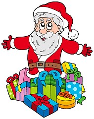 Image showing Santa Claus with pile of gifts