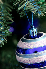 Image showing Christmas ornaments on tree.