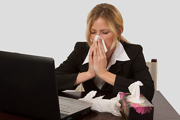 Image showing Woman blowing nose