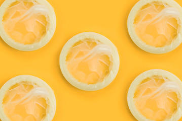 Image showing condoms on orange background