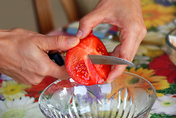 Image showing Cutting tomato