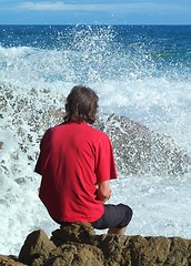 Image showing Man in red sea spray