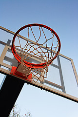 Image showing Basketball hoop against a blue sky.