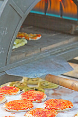 Image showing Preparing a tasty pizza in the oven