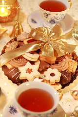 Image showing Hot tea with sweet cookies