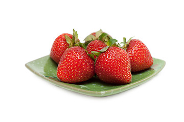 Image showing Strawberries on green chinese saucer