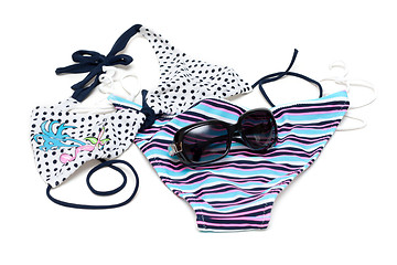 Image showing Sunglasses to rest upon swimsuit