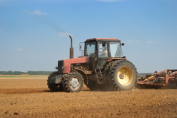 Image showing Agriculture ploughing tractor outdoors