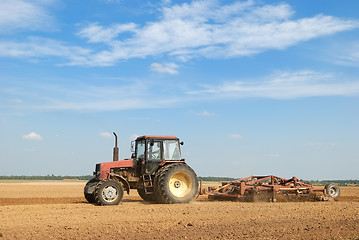 Image showing Agriculture ploughing tractor outdoors