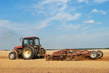 Image showing Agriculture ploughing tractor outdoors