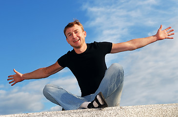 Image showing young happy welcoming man