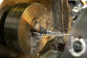 Image showing drilling a hole in blank on turning machine