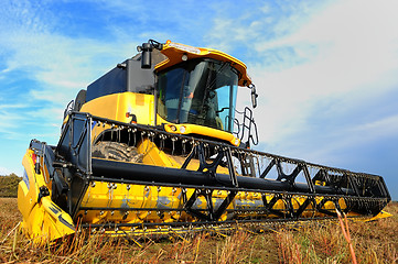 Image showing harvesting combine in the field