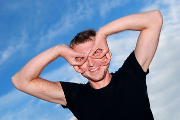 Image showing funny young man outdoors