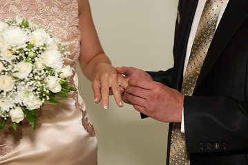 Image showing putting on a wedding ring