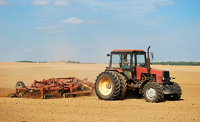 Image showing Ploghing tractor