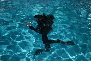 Image showing Diver moving underwater