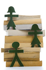 Image showing Green People on a pile of books