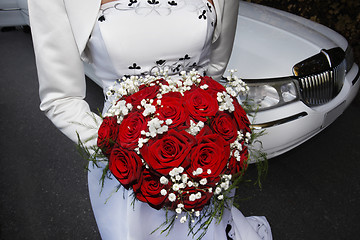 Image showing Bride standing front of  a limosine