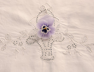 Image showing pansy on tablecloth