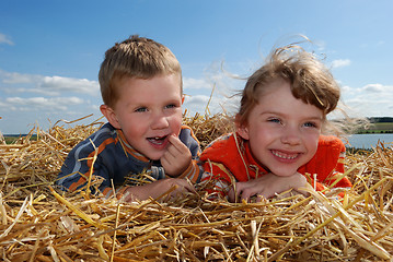 Image showing smiling boy and girl outdoors