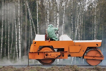 Image showing Orange road roller