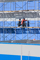 Image showing Two workers on industrial object