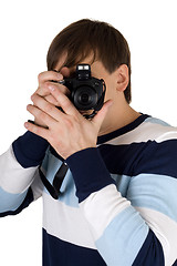 Image showing Young man with a camera. Isolated on white