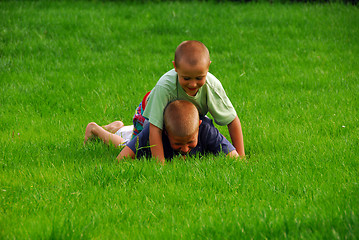 Image showing boys play on the grass