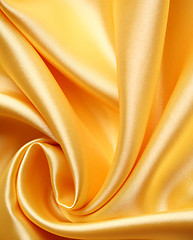 Image showing Smooth elegant golden satin as background 