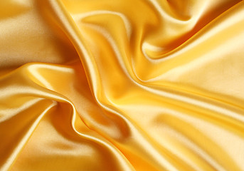 Image showing Smooth elegant golden satin as background 