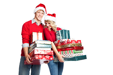 Image showing Christmas shopping couple carrying gifts