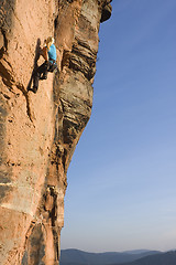 Image showing Young woman climbing
