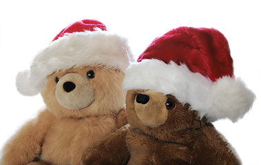 Image showing two teddy bears in Santa hats