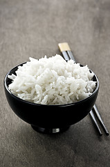 Image showing Rice bowl and chopsticks