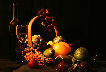 Image showing Classical composition: glasses with basket of grapes and vegetab