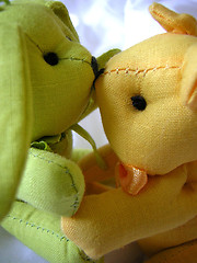 Image showing cute toy bears cuddling