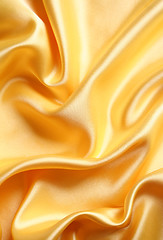 Image showing Smooth elegant golden satin as background 