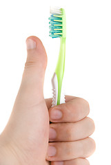 Image showing Hand with toothbrush
